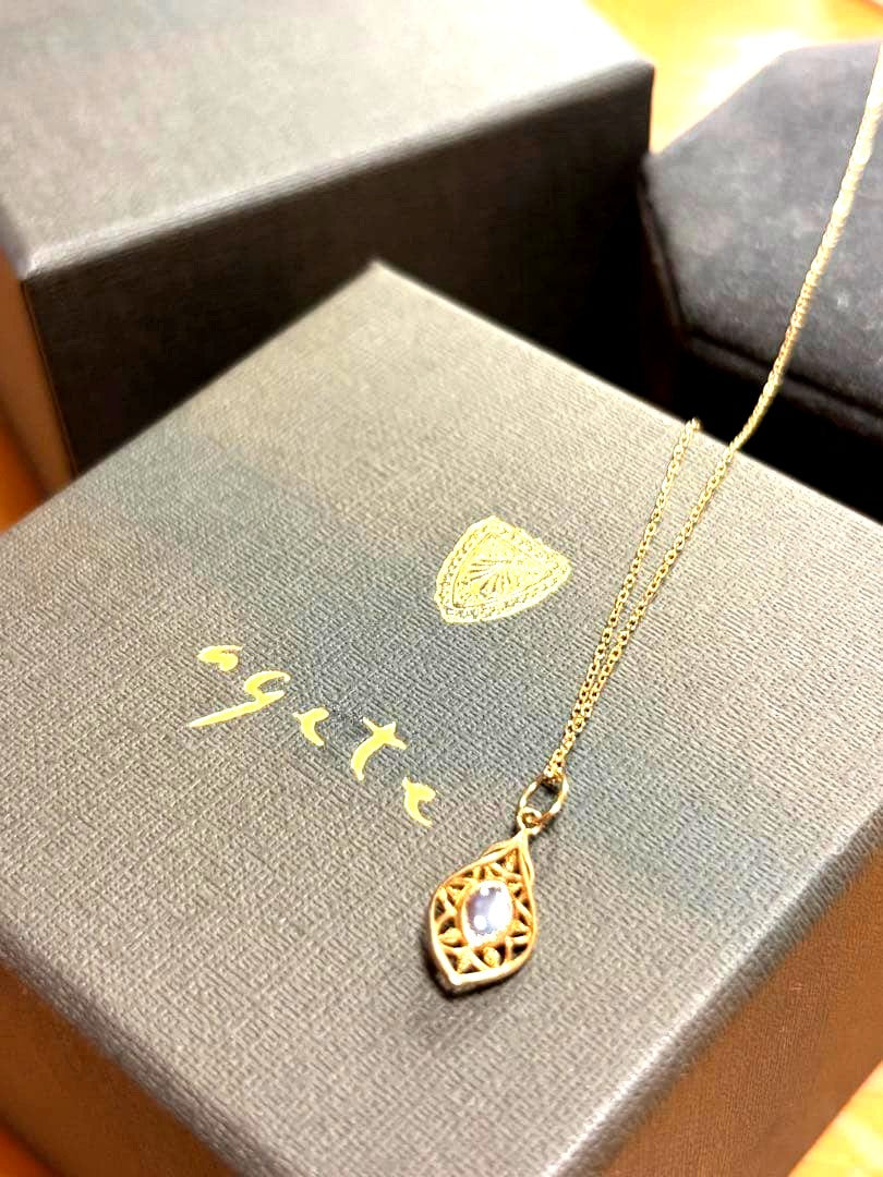 Agete K10 Multi-Stone Charm Necklace with yellow garnet and shell charms on a 45cm yellow gold chain