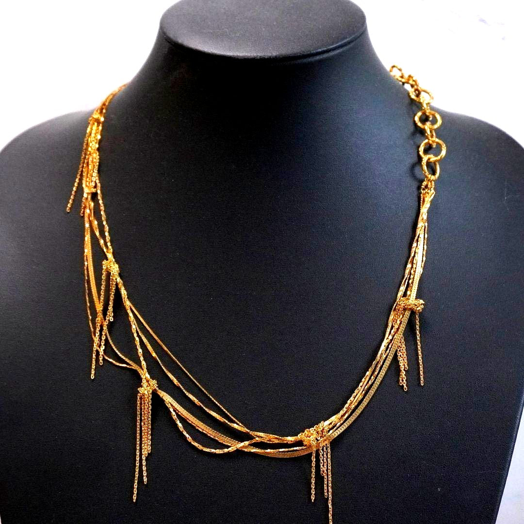Agete 5-row gold necklace with long adjustable chain showing its length and clasp