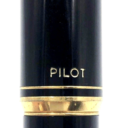 Pilot fountain pen with 14K gold fine nib, sleek black barrel, and silver clip made in Japan