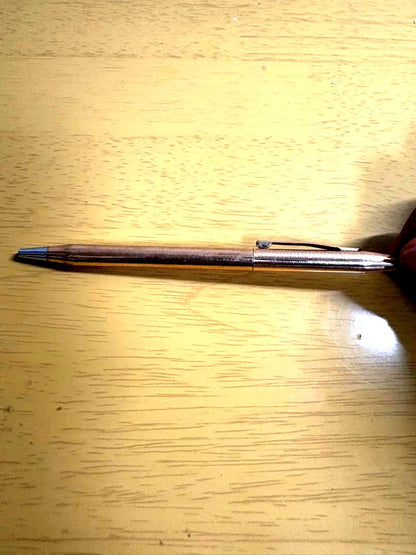 Used Cross ballpoint pen with visible scratches and no case included