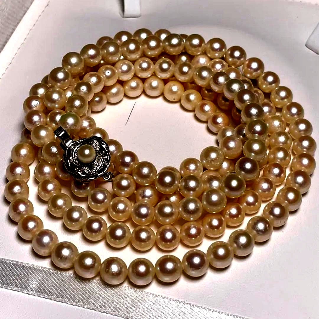 Akoya pearl long necklace with round white pearls 6.9-7.4mm in tsumami style on a silvery chain
