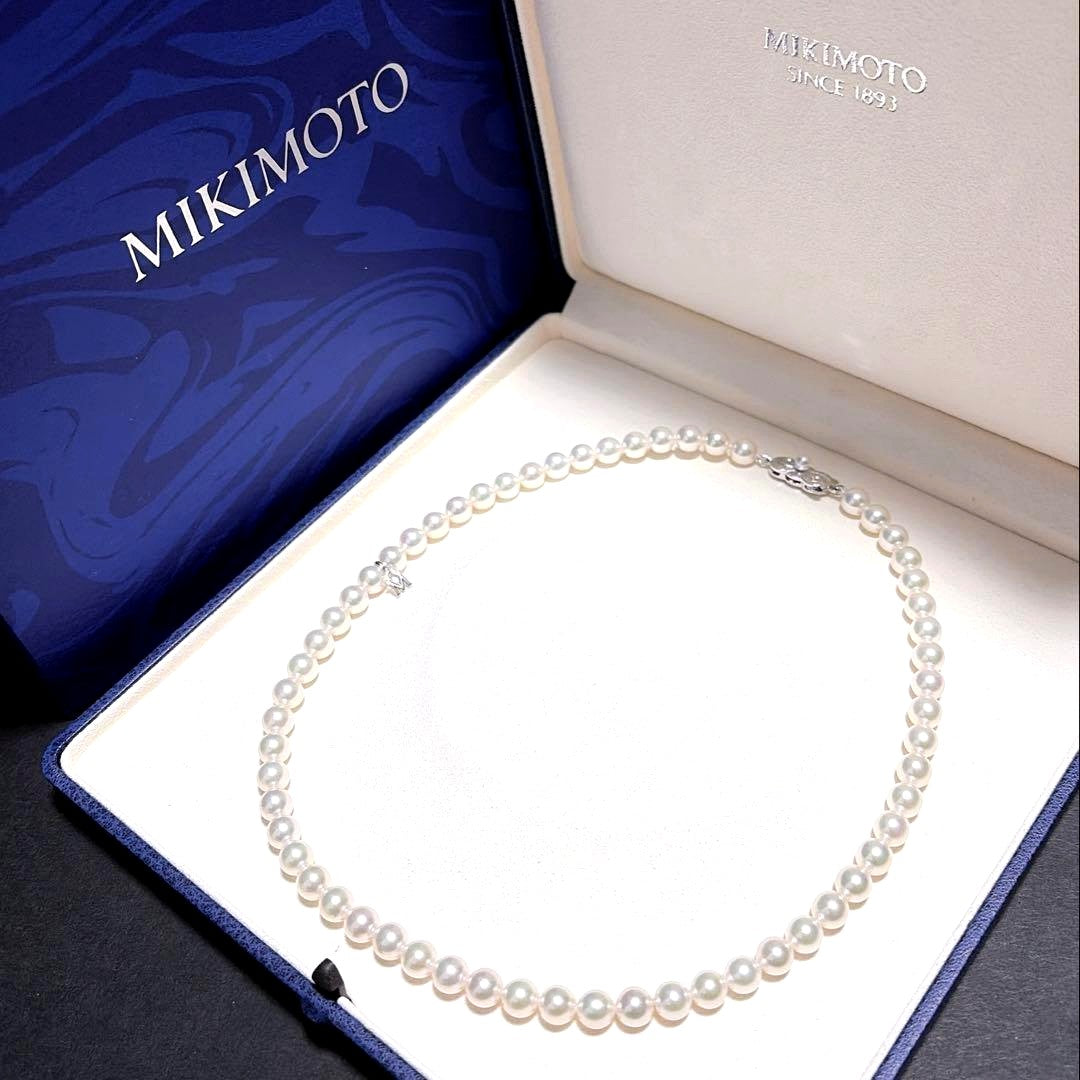 Mikimoto Akoya Pearl Necklace with 7.0 mm pearls and charm, 42cm length, displayed on white background