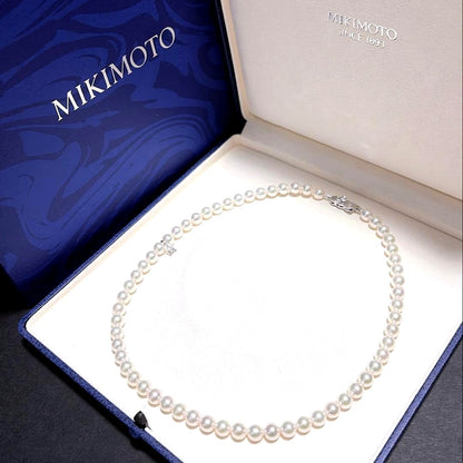 Mikimoto Akoya Pearl Necklace with 7.0 mm pearls and charm, 42cm length, displayed on white background