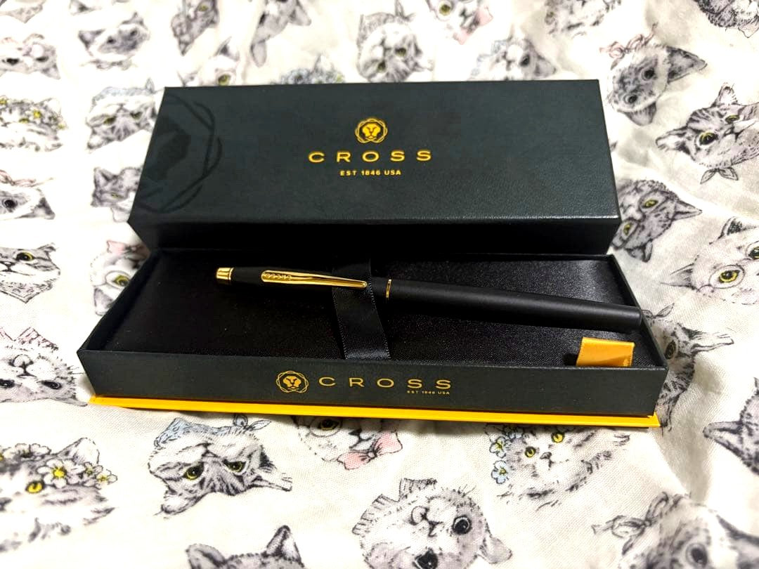 Cross Cap ballpoint pen with matte black body and gold clip, cap-style metal pen