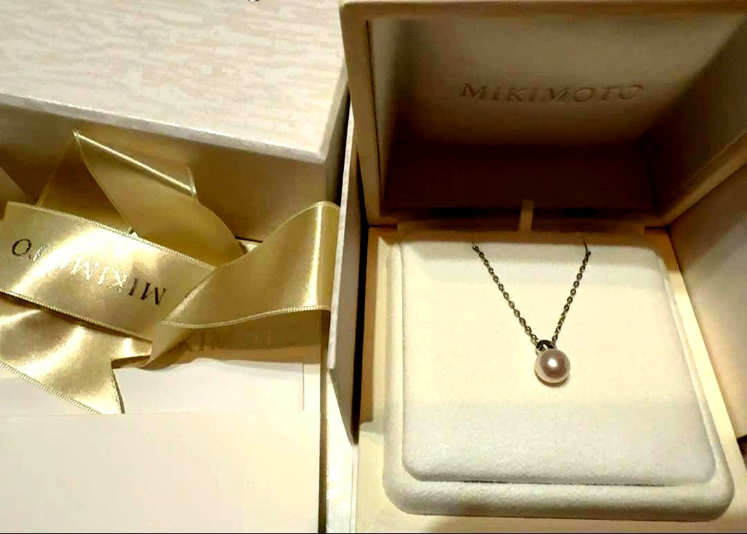 Mikimoto Pearl Pendant Necklace with simple design and adjustable chain displayed with gift box and ribbon