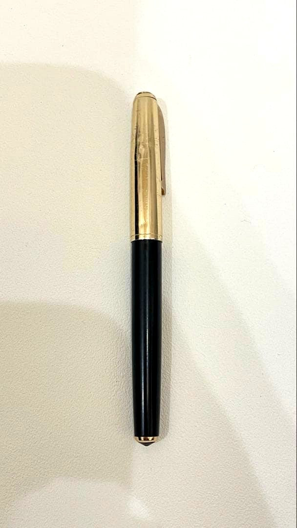 PILOT Fountain Pen with 14K gold nib and sleek black barrel, elegant writing instrument