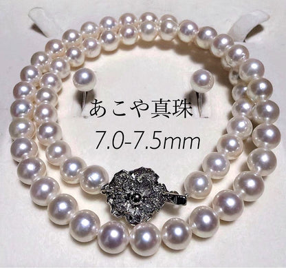 Akoya pearl necklace and matching earrings set with K14WG and silver clasps on white background