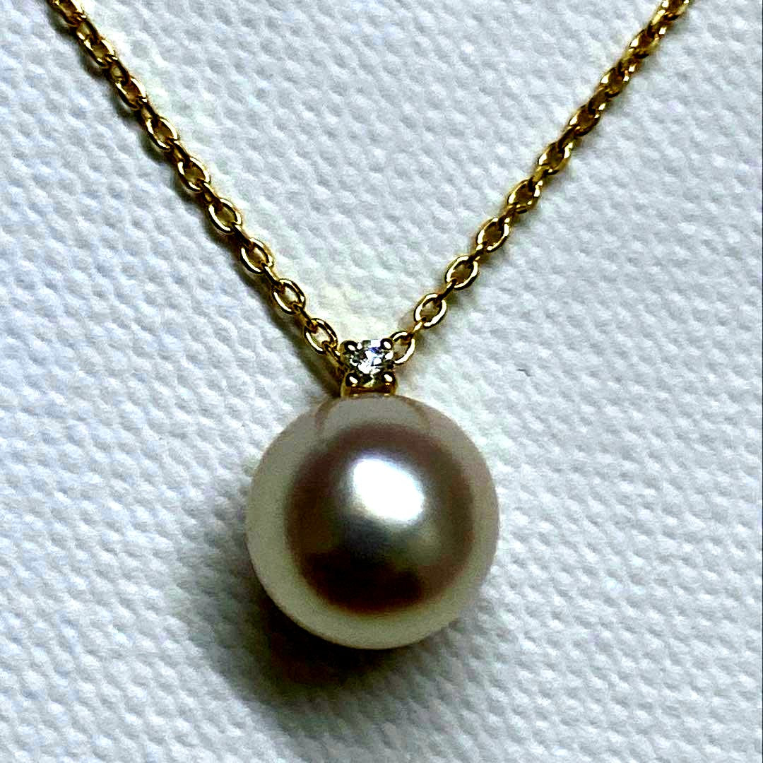 Tasaki K18 gold necklace featuring an 8mm Akoya pearl and a small diamond on a koza chain