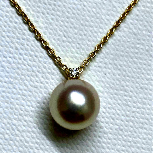 Tasaki K18 gold necklace featuring an 8mm Akoya pearl and a small diamond on a koza chain