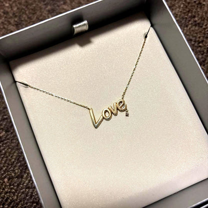 Agat K10 LOVE Necklace with a pointed 0.01 carat diamond and adjustable two-stage chain