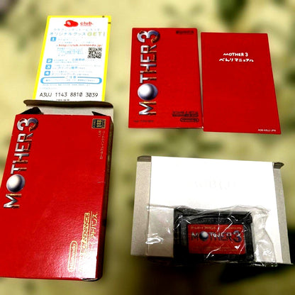 Game Boy Advance MOTHER3 game cartridge with original box and manual showing wear and aging signs