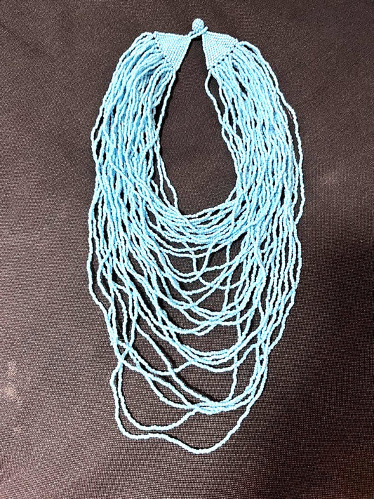 agete turquoise blue beads multi-layer necklace with knotted clasp displayed on white background