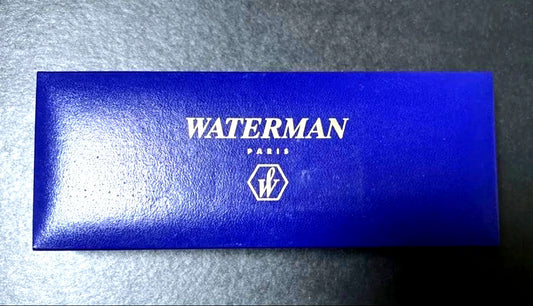 WATERMAN black ballpoint pen and mechanical pencil set with gold accents on a white background