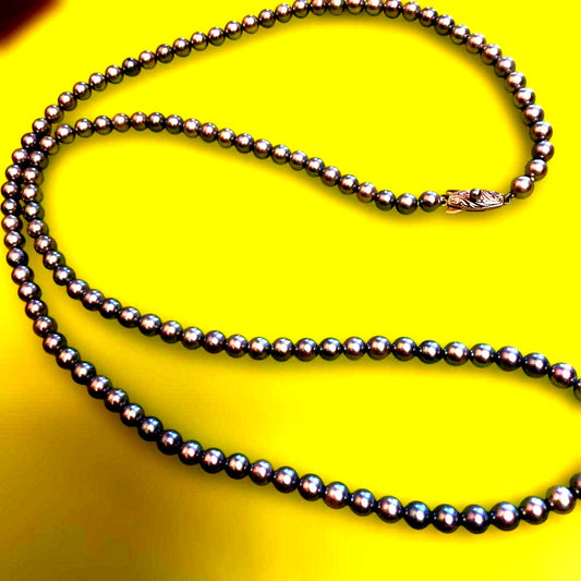 Tasaki silver pearl necklace with fish-shaped clasp, approximately 80 cm long