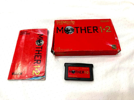 Mother 1+2 game cartridge for Game Boy Advance with original box showing wear and tears
