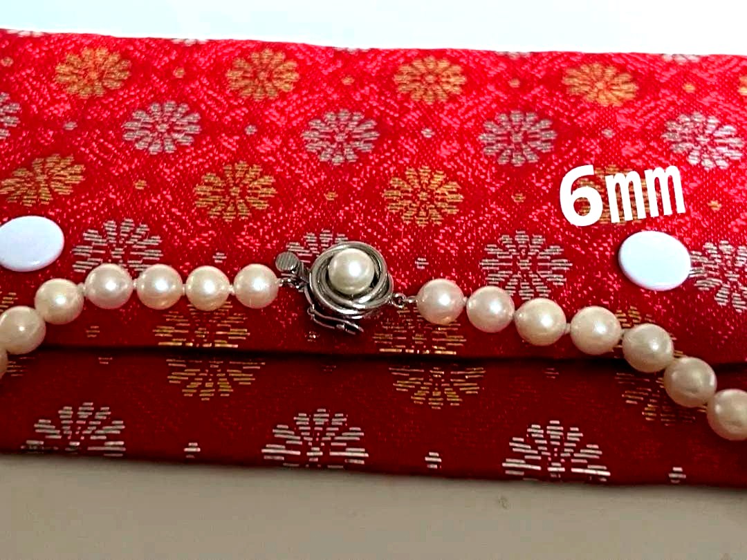Akoya pearl necklace featuring a 6mm white pearl on a 43cm silver chain with a double lock princess clasp
