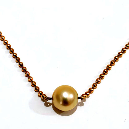 Mikimoto pearl necklace with 6.9mm pearl set in 18K yellow gold pendant on 40cm chain