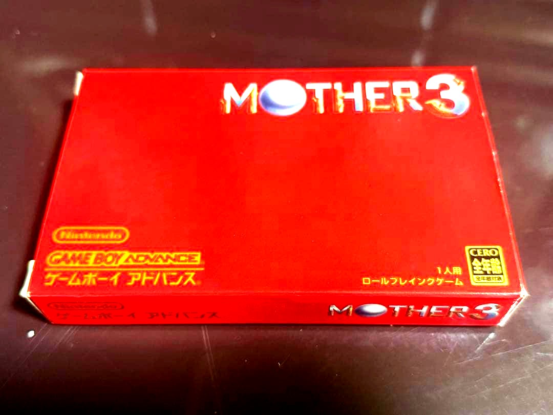 MOTHER3 game cartridge and box with bubble wrap packaging showing waterproof protection