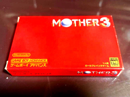 MOTHER3 game cartridge and box with bubble wrap packaging showing waterproof protection