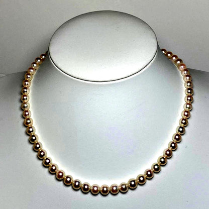 K906 Akoya pearl necklace with 6.5-7.0 mm pearls, 42 cm length, draped against a white background