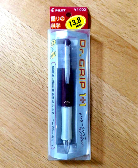Pilot Dr. Grip 1+1 multi-function pen with dark red barrel, black 0.5mm ballpoint tip, and 0.5mm mechanical pencil