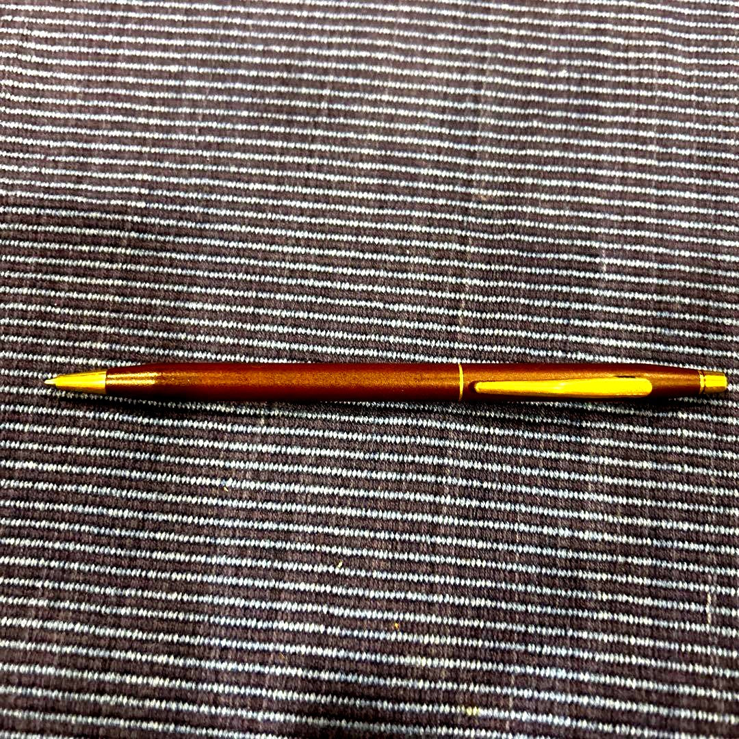 Cross ballpoint pen in wine red with gold accents showing scratches as per condition