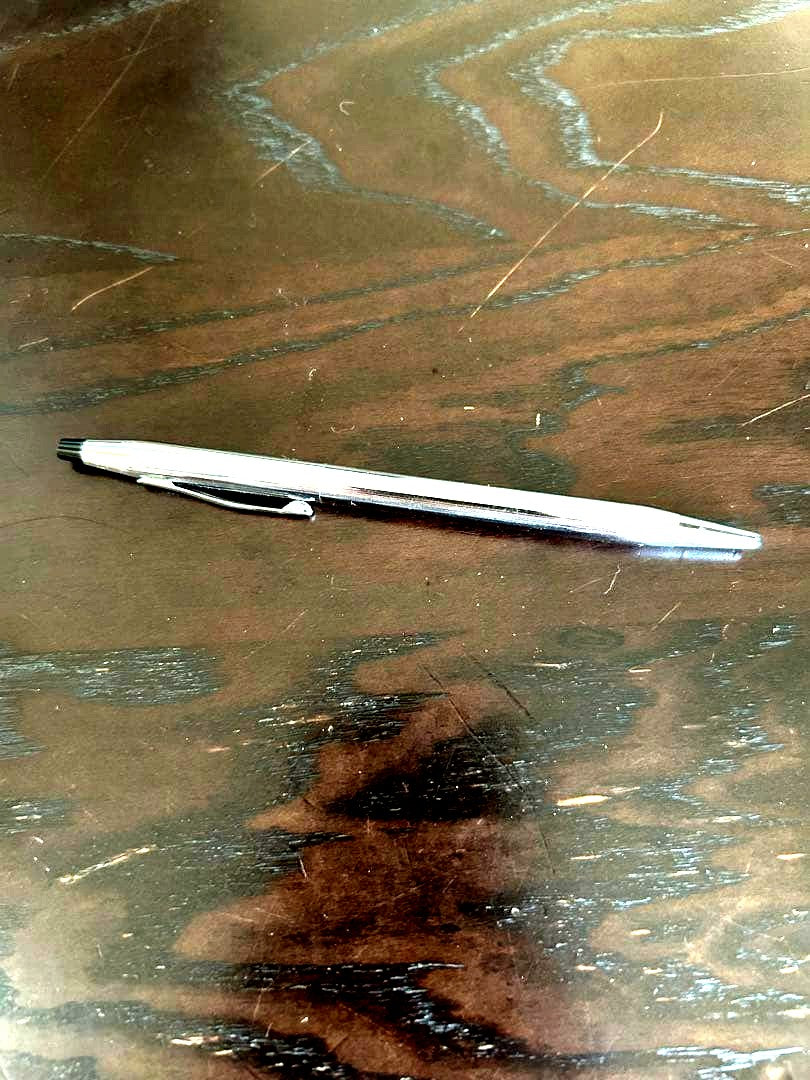 Cross ballpoint pen with twist mechanism shown uncapped on white background