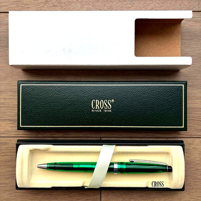 Cross Solo Translucent ballpoint pen with emerald green semi-transparent resin body showing internal mechanisms