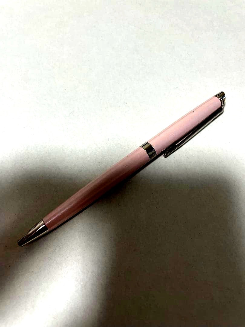 Waterman ballpoint pen in black with silver clip showing minor scratches on the body