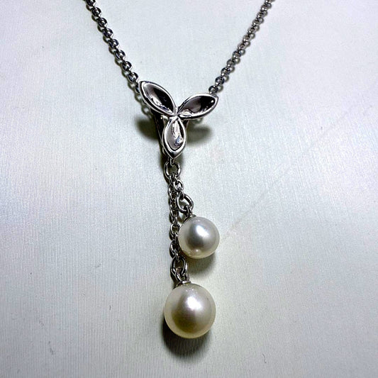 Tasaki silver necklace featuring two moving Akoya pearls on a 40 cm metal chain