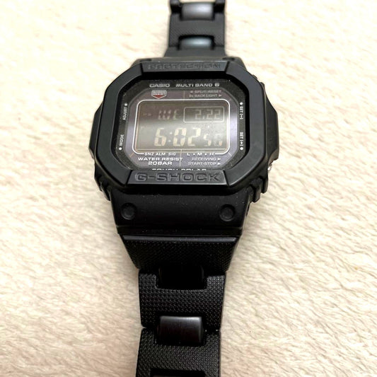 Casio G-Shock black dial solar watch showing the face and strap in like new condition