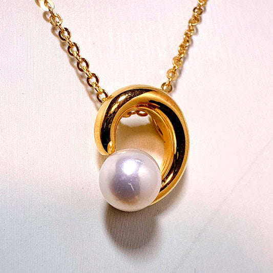 Tasaki necklace with gold color, single pearl pendant on silver and metal circular chain