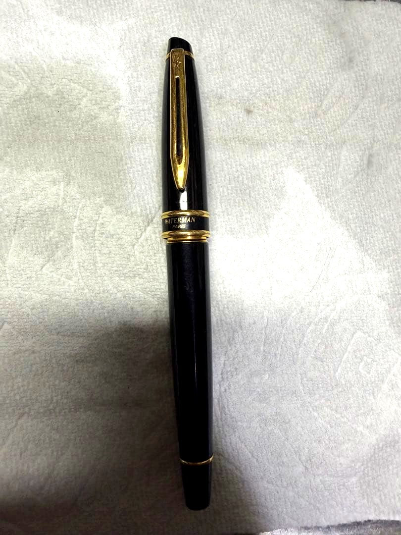 Waterman Paris black gold fountain pen with sleek design and gold accents on a white background