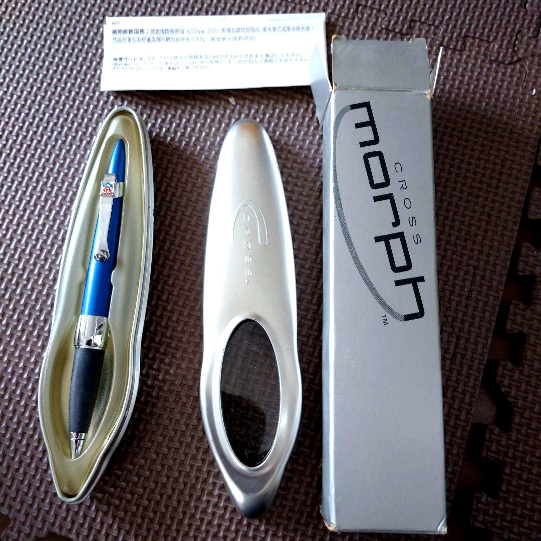 Blue Cross Morph ballpoint pen with NFL logo, metal case showing signs of age and wear