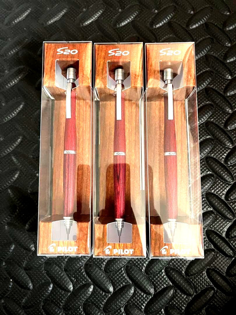 Three deep red PILOT S20 0.5mm mechanical pencils shown with sharpened tips