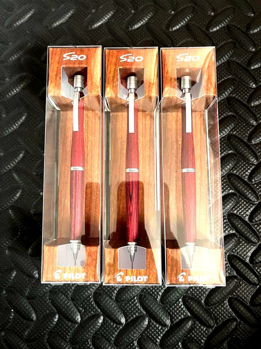 Three deep red PILOT S20 0.5mm mechanical pencils shown with sharpened tips