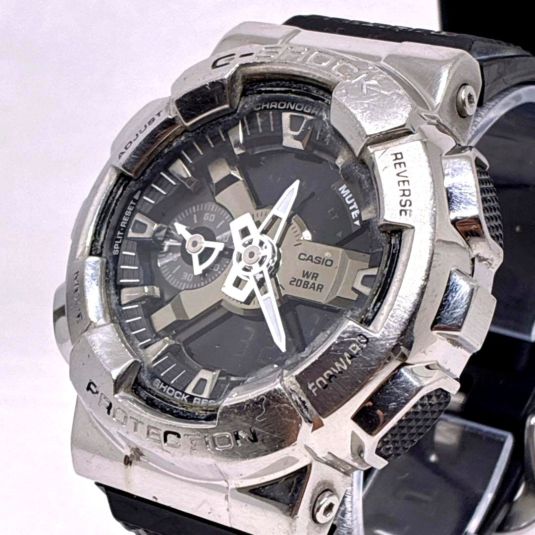 Casio G-Shock GM-110-1AJF digital analog watch with metal bezel and black resin band