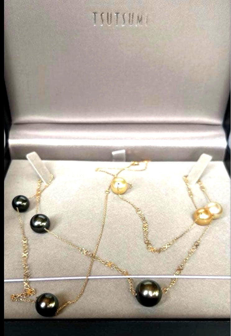 Jewelry Tsutsumi South Sea white butterfly pearl necklace with 12.5mm pearls on a white background