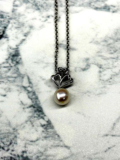 TASKA 7.1mm Akoya pearl necklace with silver mark on 40cm chain displayed on white background
