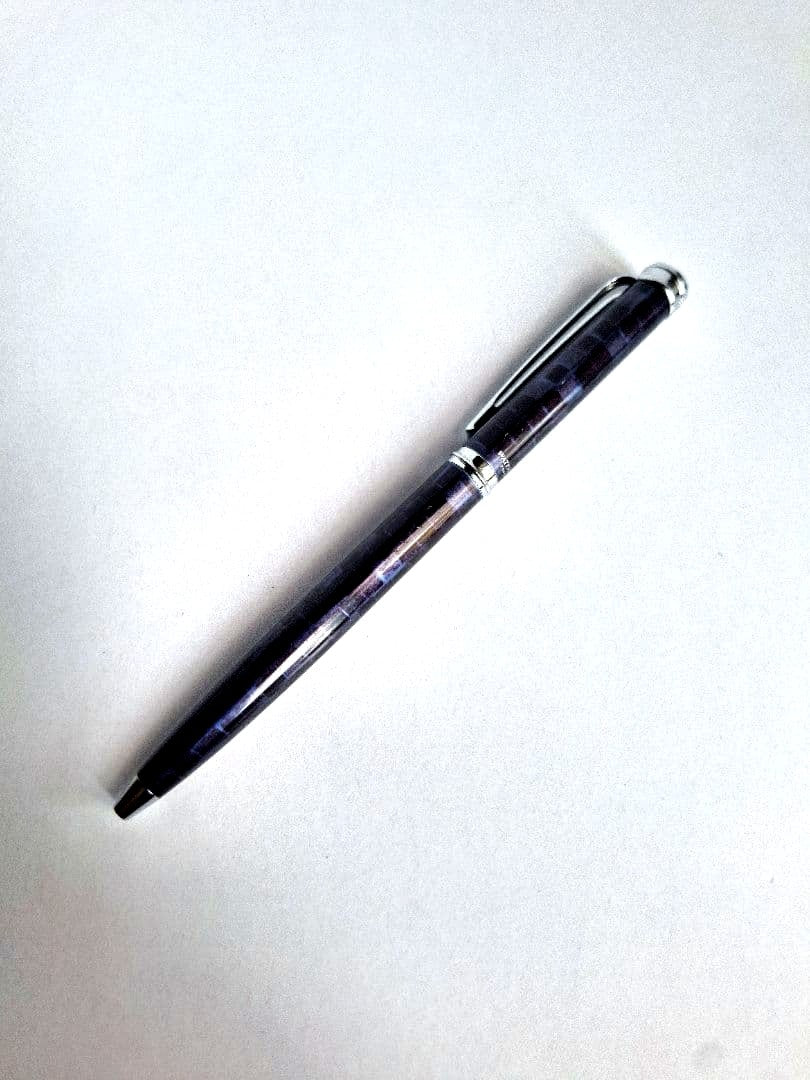 Waterman ballpoint pen with blue and black marble pattern and simple clip on metal and plastic body