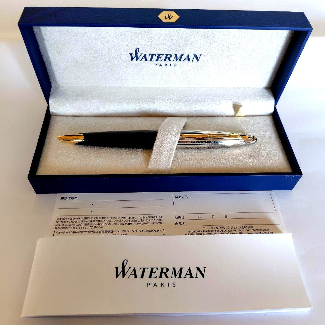 Waterman ballpoint pen with company name marking, unused with slight discoloration on clip