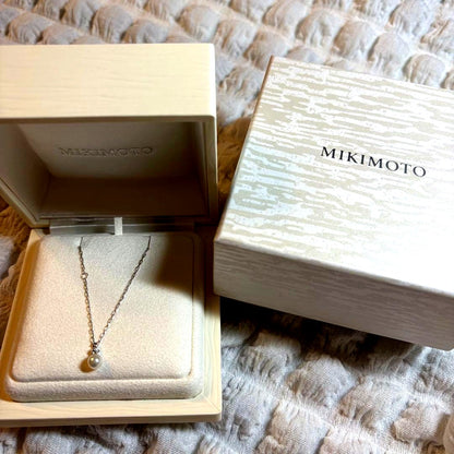 Mikimoto K18 white gold Akoya pearl necklace featuring 5.25mm pearls and small diamond accents, 40cm adjustable length