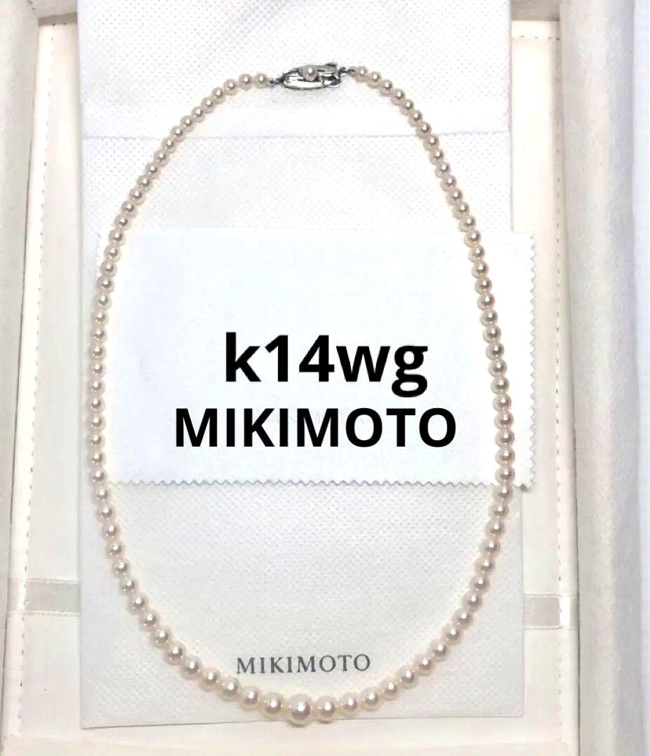 K14wg Mikimoto Akoya baby pearl necklace with gradient sized pearls and 44 cm length on white background