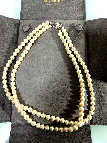 Mikimoto two-row pearl necklace featuring 6mm freshwater pearls with 42cm length, displayed on a white background