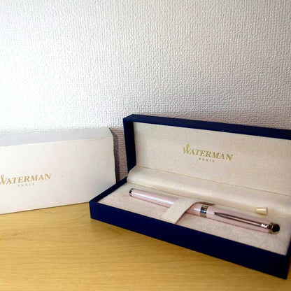 Pink WATERMAN Metropolitan series fountain pen with its storage case on a white background
