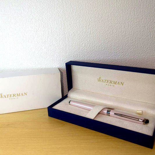 Pink WATERMAN Metropolitan series fountain pen with its storage case on a white background