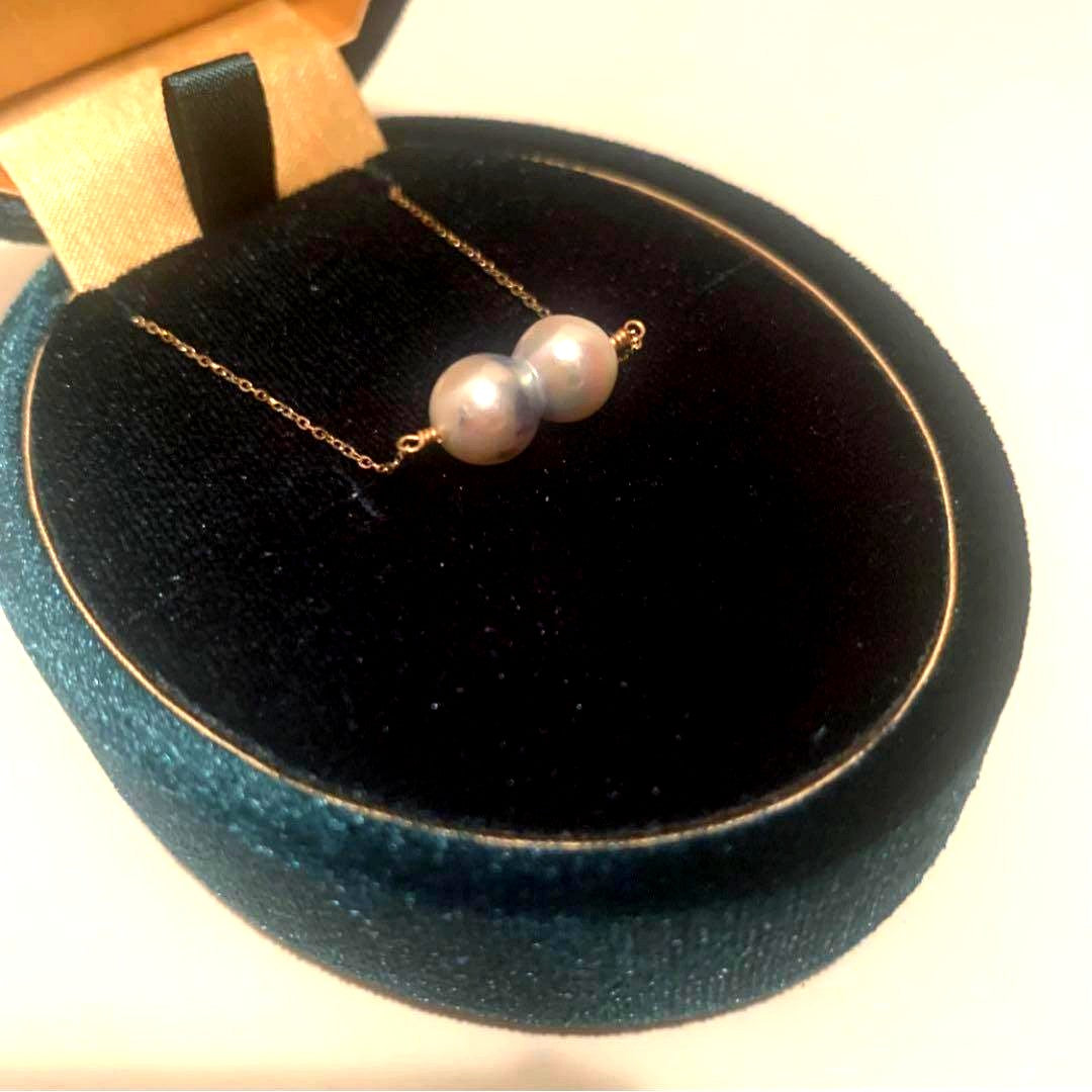 Twin Akoya pearl necklace with 10K gold chain and deep sea-inspired design