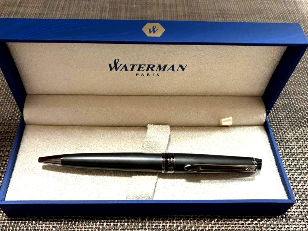 Waterman black ballpoint pen shown with its dedicated black case on a white background