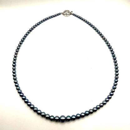 Akoya pearl necklace with metallic blue gradient baby pearls sized 3 to 7 mm on a 44 cm chain
