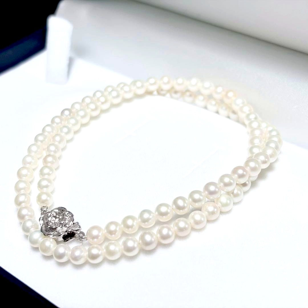 Baby Pearl Akoya genuine pearl necklace with 4.5mm pearls and silver fittings on a white background